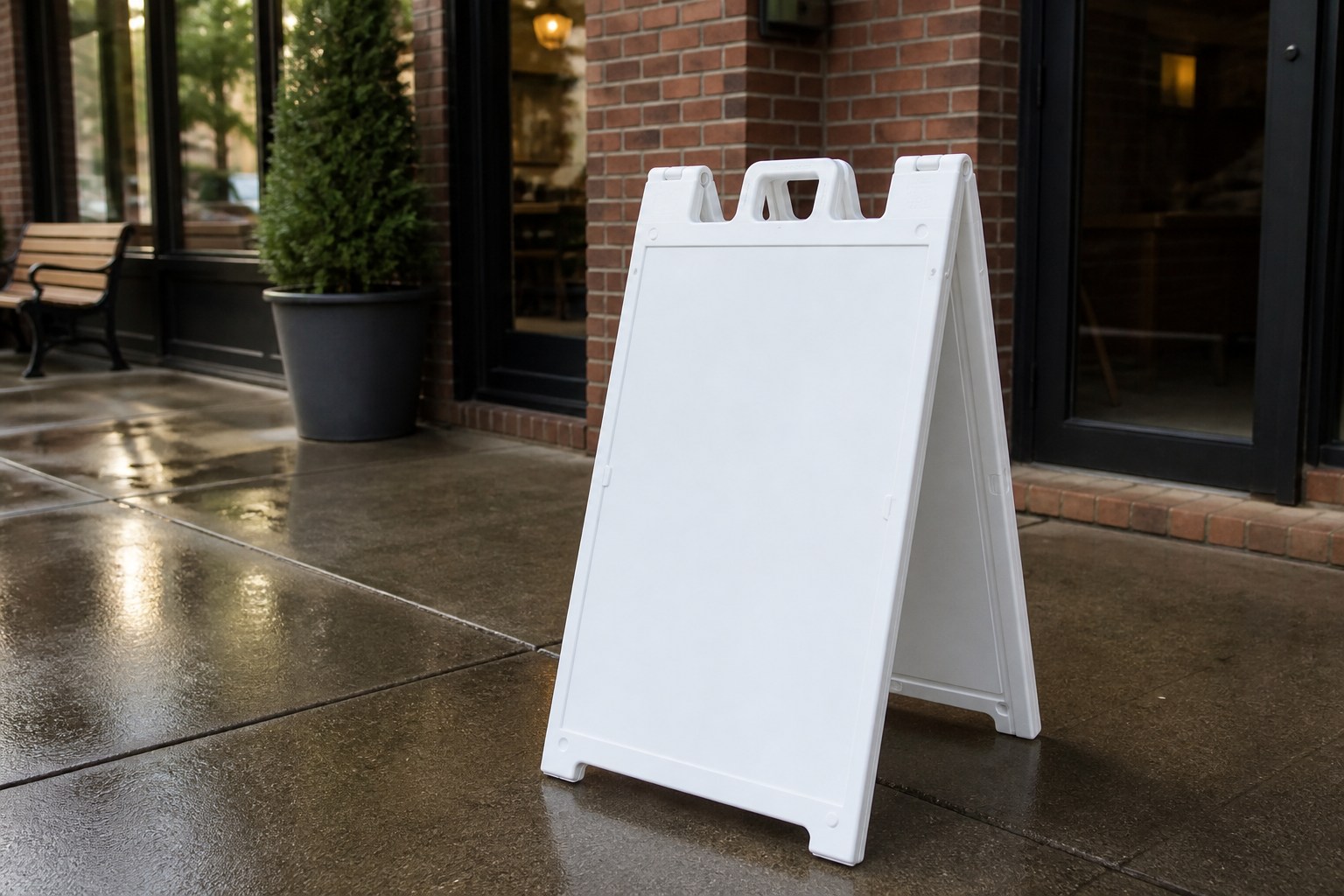 Blank white Signicade A-frame standing on a cafe sidewalk