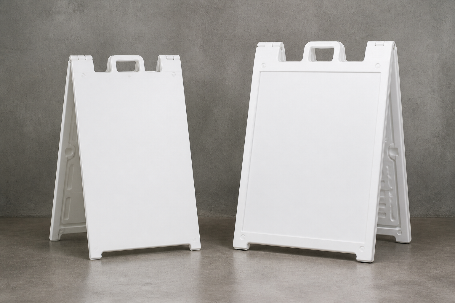 Two blank white A-frame stands side by side, flat vinyl face next to a recessed insert frame