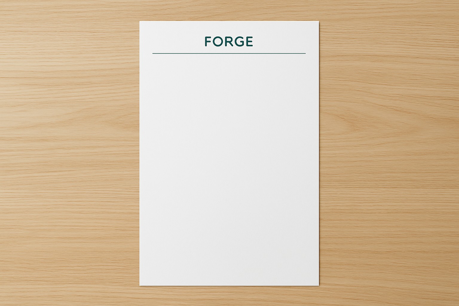 Tall 8.5 by 14 inch legal letterhead sheet on a desk with a small header mark and an empty writing area