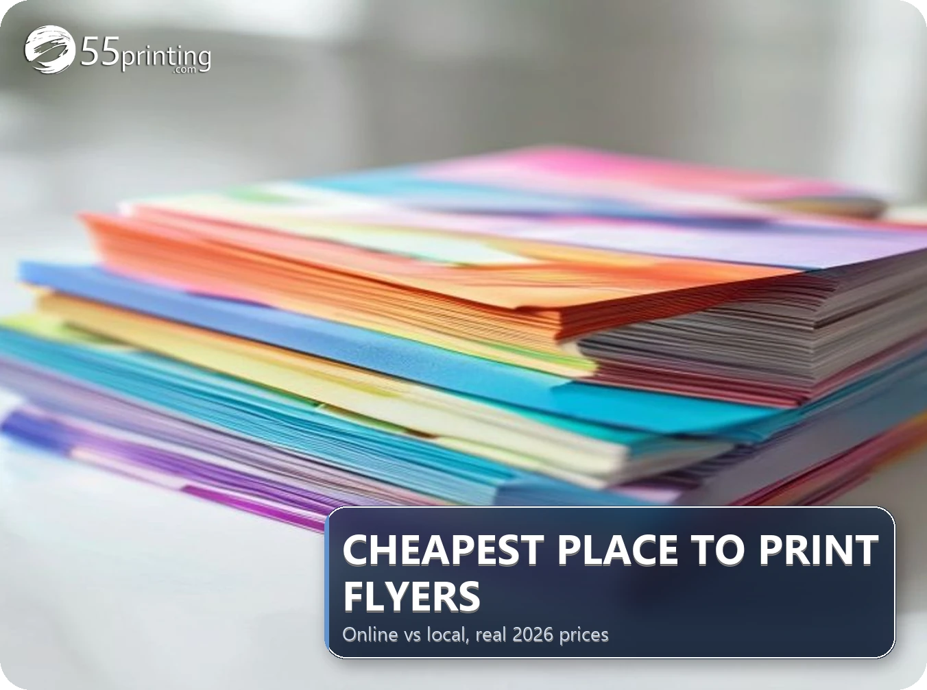 Fan of full-color printed flyers held in one hand showing vivid colors and gloss finish