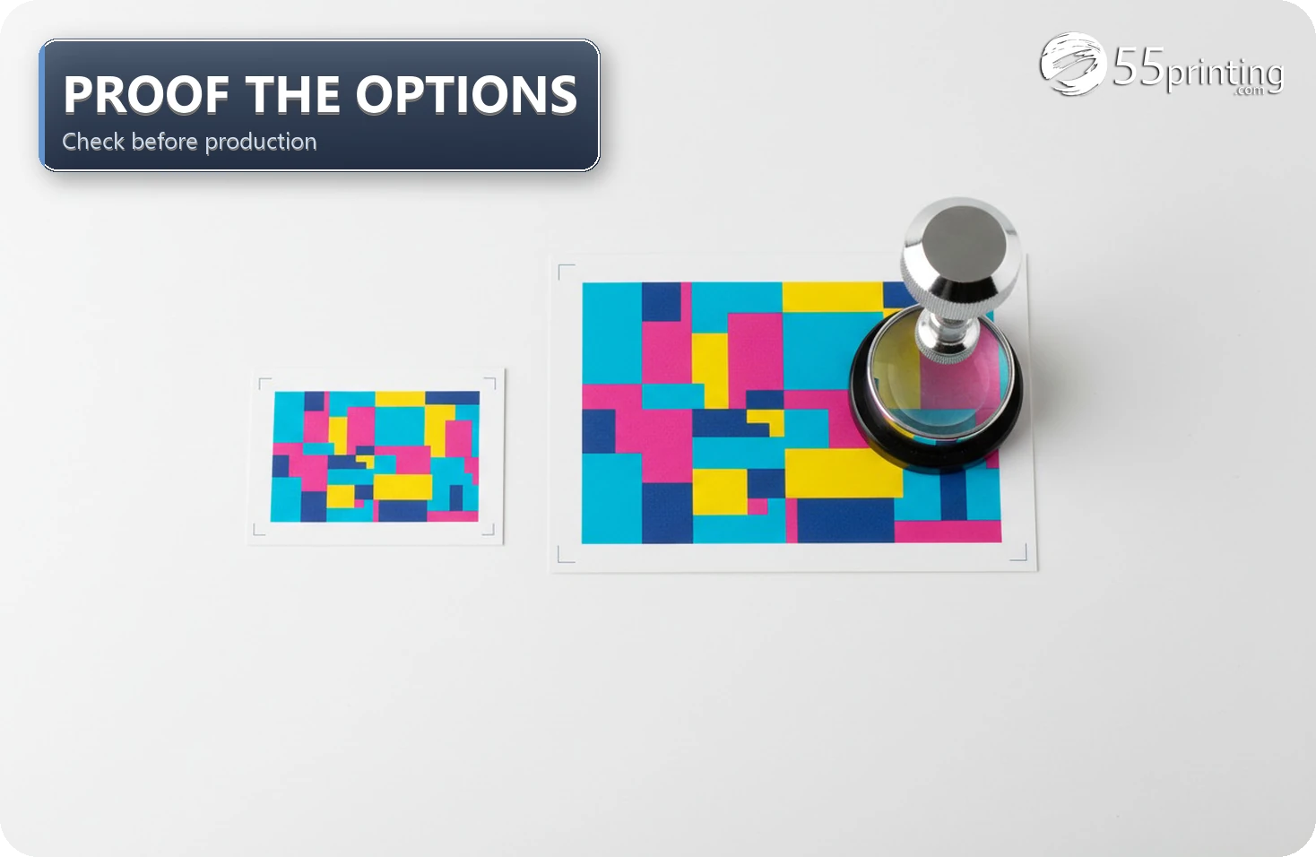 Business card and postcard color proofs with crop marks inspected under a magnifying loupe